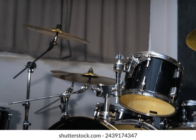 Part of a drum kit with cymbals in a music studio, on stage. Background for photos with live music, rock
