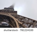 The part of Eiffel tower bottom view in the misty foggy day. Concept Eiffel tower in the mist.