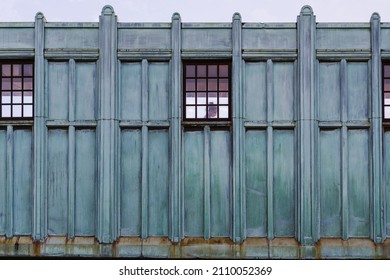 Part Of Elevated Station In Boston. Green Metal Wall Exterior Of A Train Platform