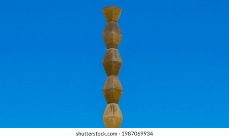 Part of the Endless Column or the Infinity Column against the blue sky. Stone sculpture of the famous sculptor Constantin Brancusi