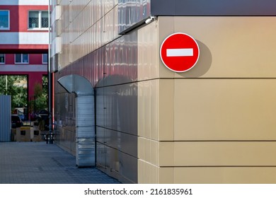 Part of the facade of the building with an installed sign forbidding passage. - Shutterstock ID 2161835961