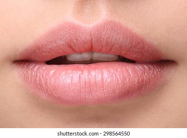Part of face,young woman close up. Sexy plump lips without makeup
