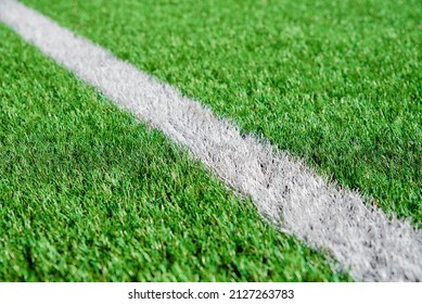 Part Of Football Or Soccer Field Close Up, Artifical Green Grass With White Border Lines, Astroturf At Stadium For Spart Games