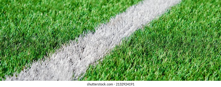 Part Of Football Or Soccer Field Close Up, Artifical Green Grass With White Border Lines, Astroturf At Stadium For Spart Games