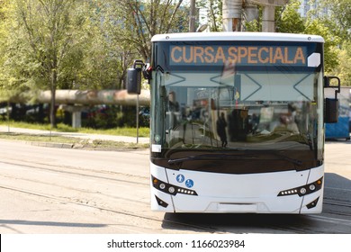 Part Of Front Door Of A Fast Moving In Sunny City , Eco Driven Autobuses In Bus Depot, Part Of City Cheap Safe Public Transport. Romanian Special Course Transport