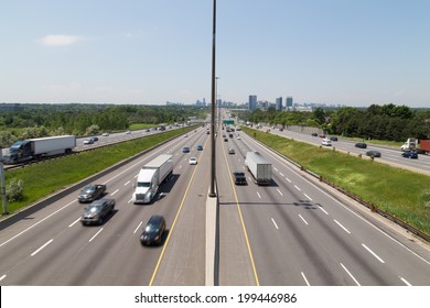 Part Of Highway 401 In Toronto During The Day Showing The Blur Of Traffic On The Road