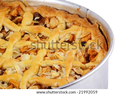 Part of a homemade apple pie, isolated on white.