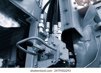 Part of a hydraulic industrial machine, control levers of a hydraulic machine, industrial concept - Powered by Shutterstock