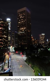 Part Of The Los Angeles Skyline At Night With Empty Street.