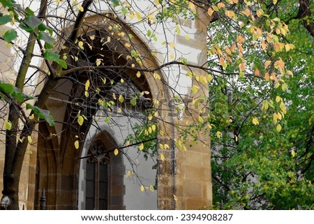 Part of Lutheran Cathedral of Saint Mary (Catedrala Evanghelica de Confesiune Augustana Sfanta Maria) and autumn leaves in Sibiu, Transylvania, Romania