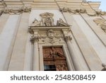 Part of the main facade with entrance to the baroque Dominican church of St. Maria Rotunda of the 17th century, Vienna, Austria
