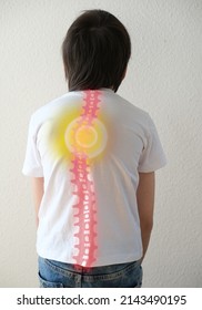 part of naked back of boy, child 10 years old in a white t-shirt , hunched over from back pain, concept of therapeutic massage for osteochondrosis, scoliosis, back pain, intervertebral hernia
