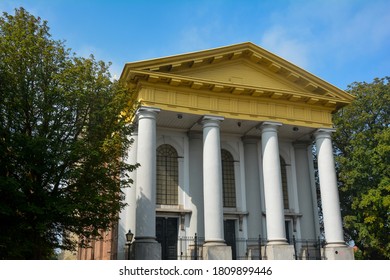 Part Of The New Church In Zieriksee, Netherlands With Blue Sky And Trees