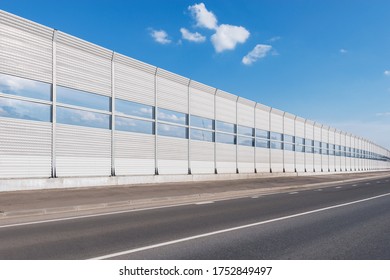 Part Of The New Highway With Noise Protection Fence Along.