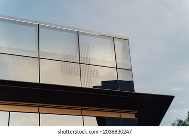 Part of an office building with the number four of the block to which it belongs. - Shutterstock ID 2036830247