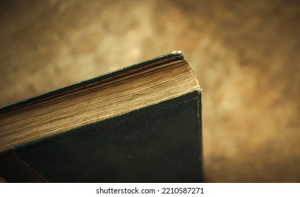 Part Of An Old Encyclopedia In Vintage Style. Yellowed Pages Of A Book On A Rectangular Banner.