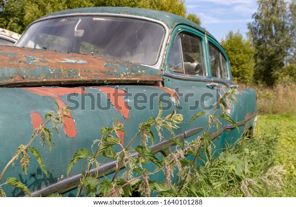 Part of an old\
rusty car, auto repair\
concept.
