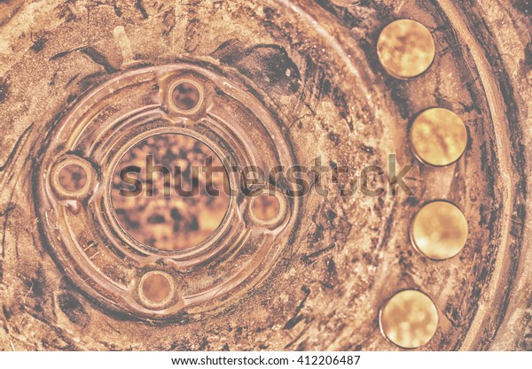 Part of  old rusty scratched automobile wheel as\
background.Closeup shoot