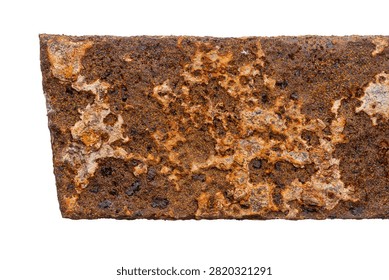 Part of old unknown rusty object isolated on white background. The usual metal detecting find.