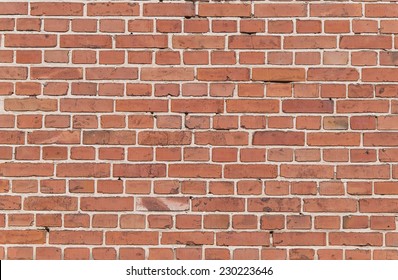 Part of an old weathered brick wall in red and brown  - Shutterstock ID 230223646