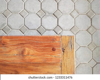 Part Of The Old Wooden Bench Made Of Sleepers Wood On Octagons Pattern Of Bricks Stone Floor Background In Train Station, Top View With Copy Space 