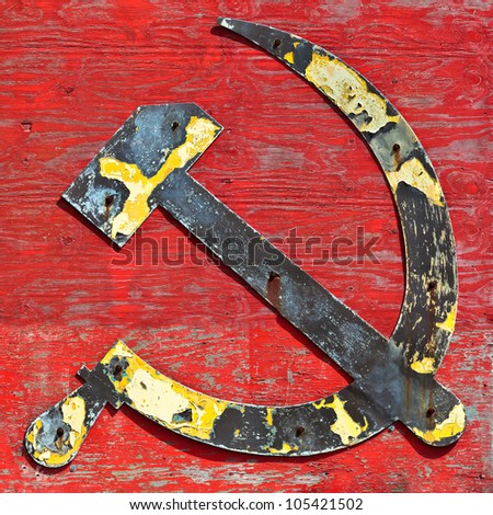 Part of an old wooden ship wreck with the cccp hammer and sickle in steel attached to it