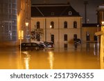 Part of the Ostrava-Svinov station building, the adjacent parking lot, and vehicles that were submerged by a flood wave on the Odra river during the floods in the Czech Republic, evening Sep. 15 2024