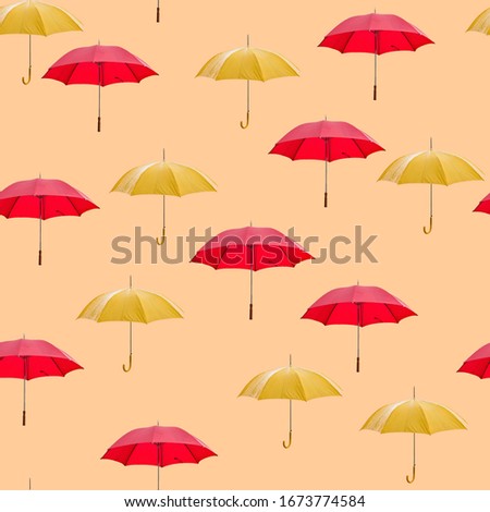 A part of a pattern, that is repeated several time on the textile, tissue paper, carpet, wallpaper, wrapping paper.
 Seamless pattern with umbrellas on the peach orange colour background.

