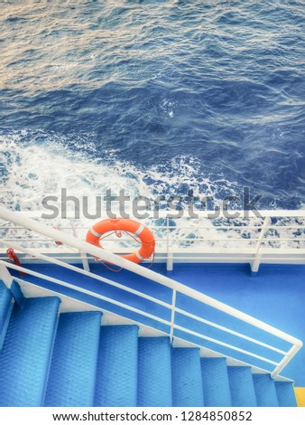 Part of a pessenger ferry with a floatation ring and metal steps