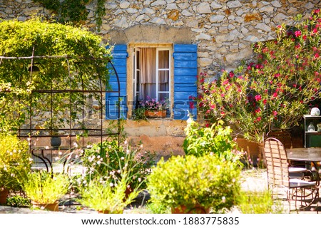 Part of provencal house of small typical town in Provence, France. Beautiful village, with french cute details on summer day. Outdoors, exteriors.