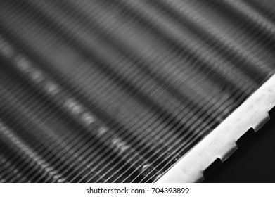 Part of the radiator for cooling the engine close-up. Steel texture.