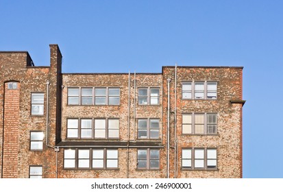 Part Of A Red Brick Industrial Warehouse Building In Manchester, UK
