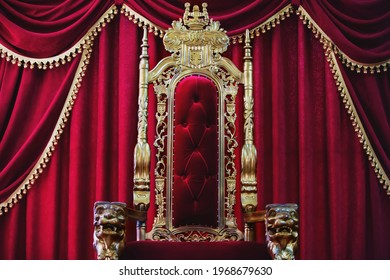 Part Of The Red Royal Chair Against The Background Of Red Curtains. A Place For A King. Throne