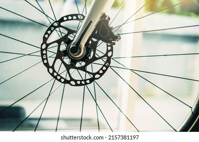 Part of road Bike brake disc in close up. Bicycle shop maintenance technical expertise. details bike front wheel axle disc brake damper. Closeup part of brake disc front wheel mountain bike. - Shutterstock ID 2157381197
