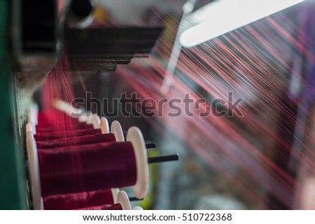 Part of the silk weaving loom with thread reels in Varanasi city. India. 