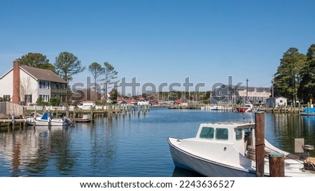 Part of St. Michaels Harbor in historic Saint Michaels, Maryland, in spring. The town's name refers to a local Episcopal parish established in 1677, frequented by tobacco growers and shipbuilders.
