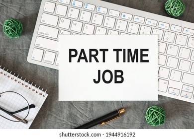 Part time job is written in a document on the office desk with office accessories. - Shutterstock ID 1944916192