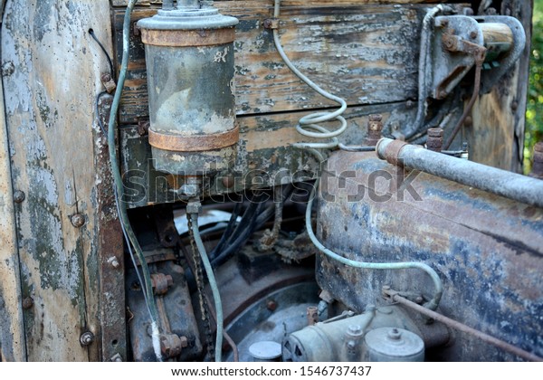 Part of vintage car, oldtimer, very old car,\
wood. Electrical coil.\
History.