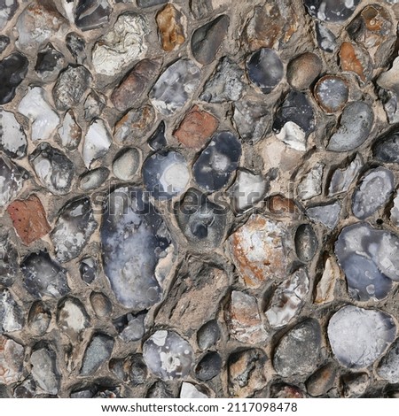 Part of a wall made out  of puddingstone.