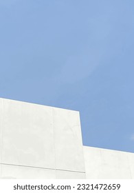 Part of white building and cloudless sky