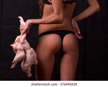 Part Of Woman Body Suffering Anorexia Nervosa. The Hungry Woman With Dead Chicken.