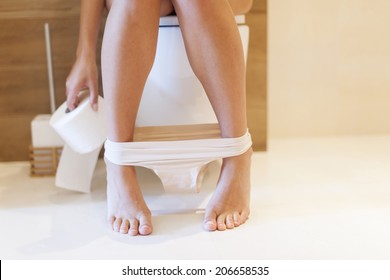 Part Of Woman On Toilet 