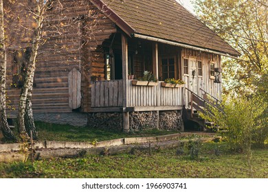 Part Of A Wooden Ranch House In The Woods At Sunset