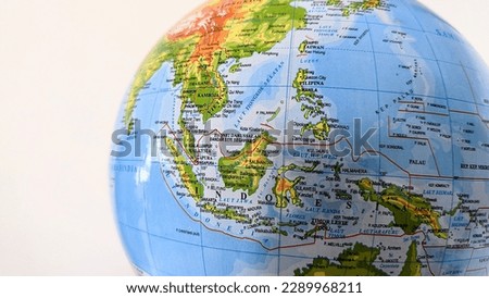 Part of a world globe showing Southeast Asia