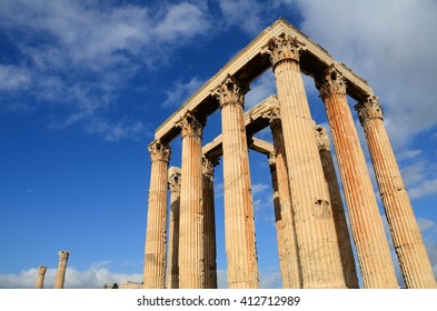 The Parthenon of the Acropolis on a background of blue sky and clouds, Greece
