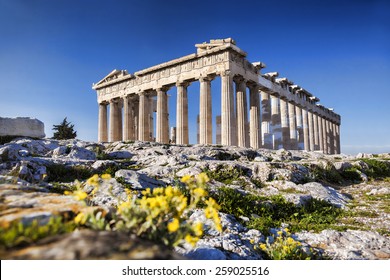 Parthenon temple with spring flowers on the  Acropolis in Athens, Greece - Shutterstock ID 259025516