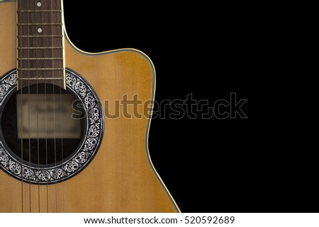 Partial of acoustic guitar isolated on black background