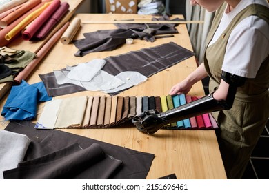 Partial Arm Of Young Woman With Disability Choosing Color Of Textile