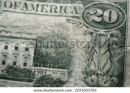 partial extreme closeup macro shot american dollar twenty 20 bill banknote word america part of white house