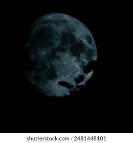 A partial lunar phase when darkness covers a large part of the Moon. The rugged lunar surface, decorated with craters, stands out against a dark background. This image is mysterious - Powered by Shutterstock